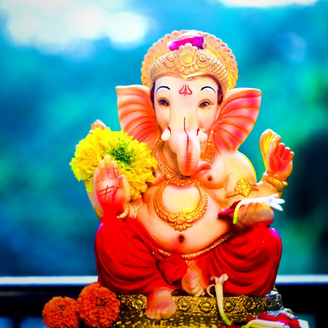 God Ganesha Eating Laddu Images